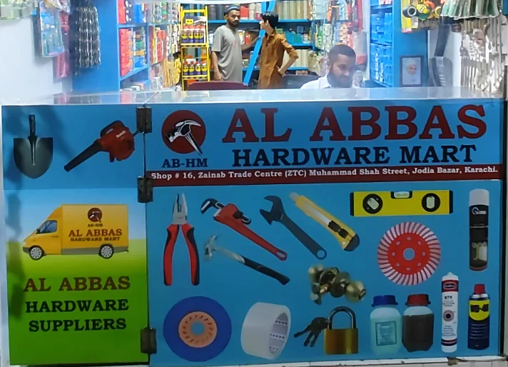 Al Abbas Hardware Mart counter with the Al Abbas Hardware Suppliers delivery van panel